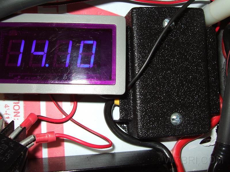 volt meter & DualBus.JPG - The LED display was washed out by the camera flash and is much brighter than it appears here. I cut the busbar's cover and drilled two holes in the top that feed though the existing mounting holes on the DualBus.